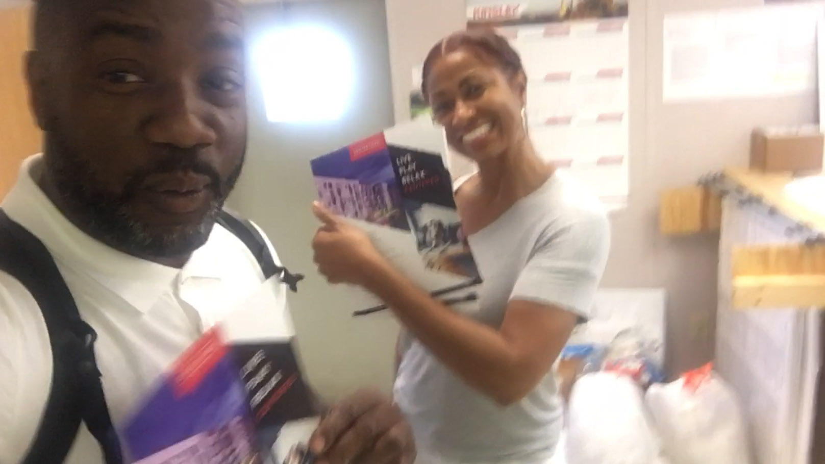 Malik with Baltimore resident and friend Andrea Carter talk marketing and promotion