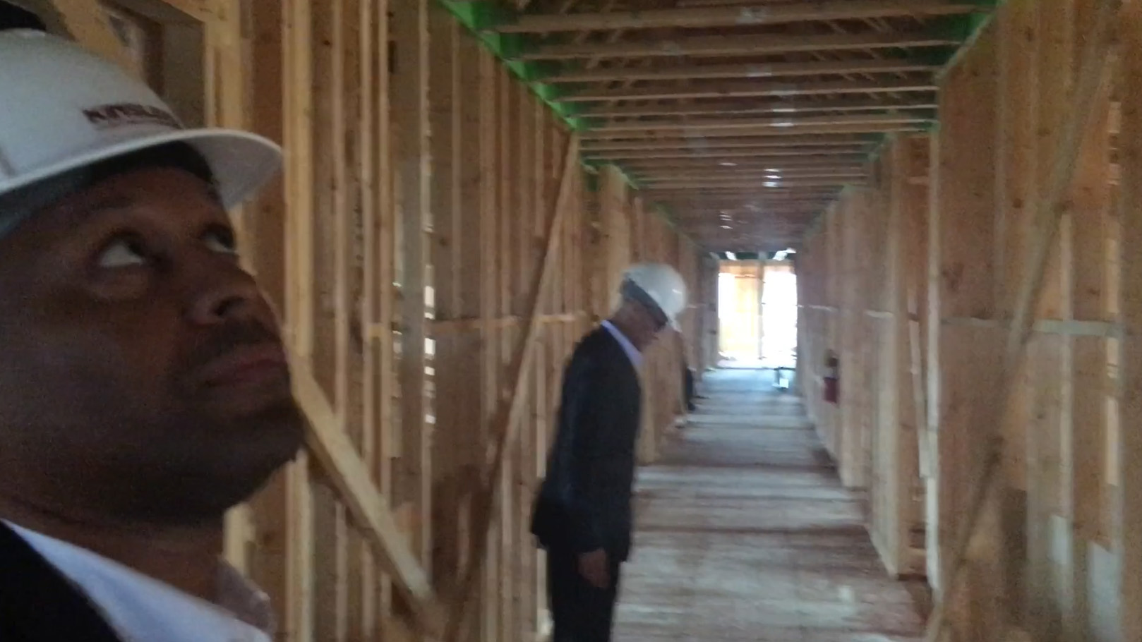 Malik Dan and Ian walk thru inspecting the framing